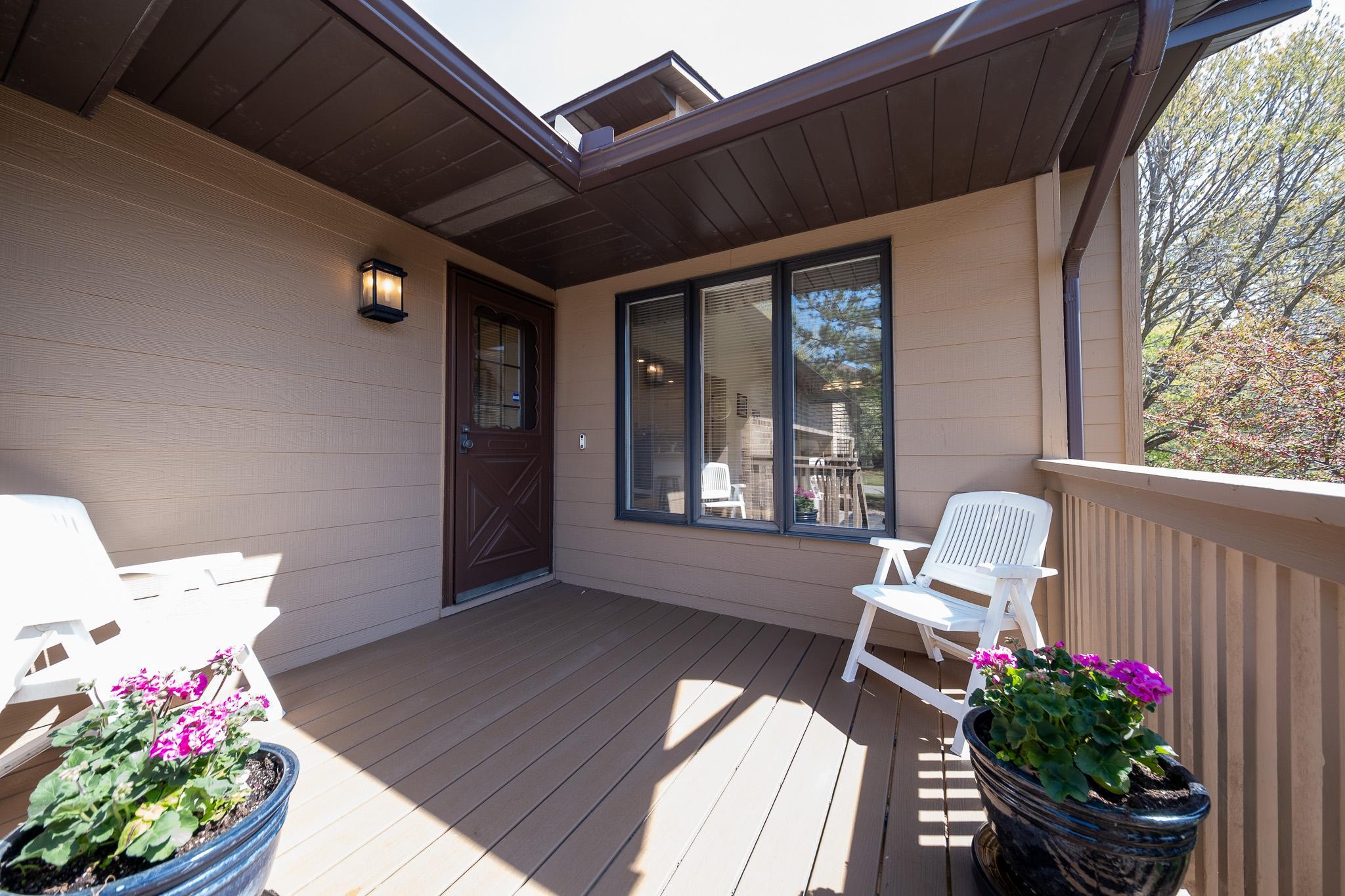 Front deck off the garage, leads into the sun room off the kitchen
