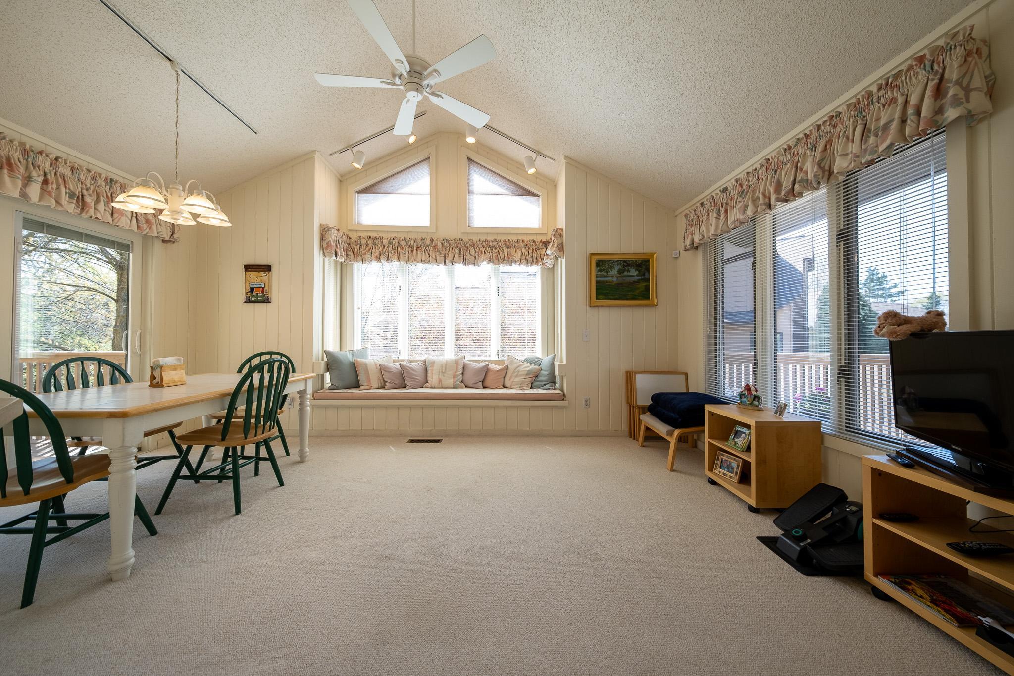 Great casual dining room off kitchen with vaulted ceilings and plenty of windows