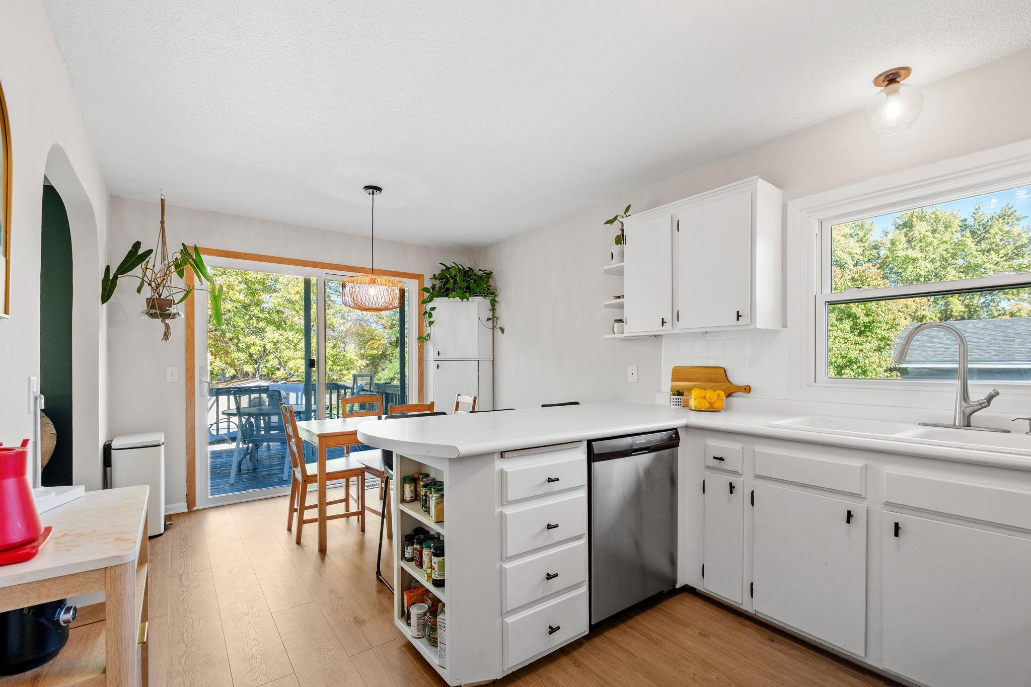 Built-in custom corner cabinet offers ample storage and a charming focal point.