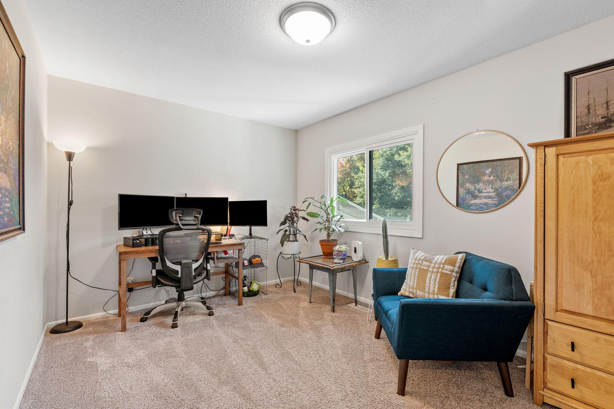 Two spacious bedrooms on the upper level offers versatility with space for an in-home office.