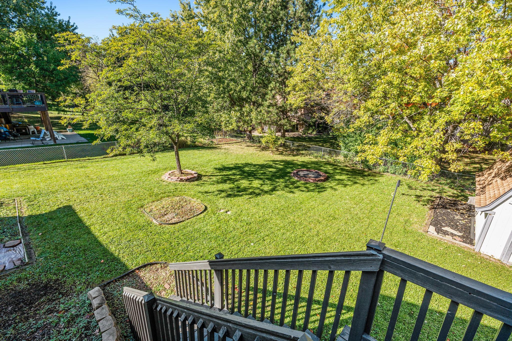 Huge fenced in back yard with fire pit and plenty of room for outdoor activities!