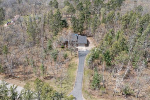 Surrounded by mature trees, this double lot offers privacy, beauty, and room to roam.