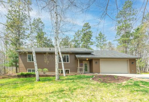 Welcome home to 2 peaceful acres surrounded by mature trees and endless possibilities.