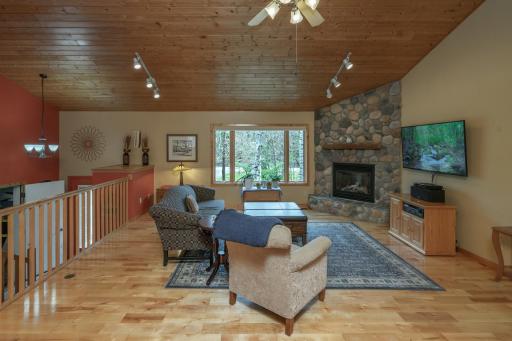 Cozy evenings come easy with a warm gas fireplace and beautiful hardwood floors.