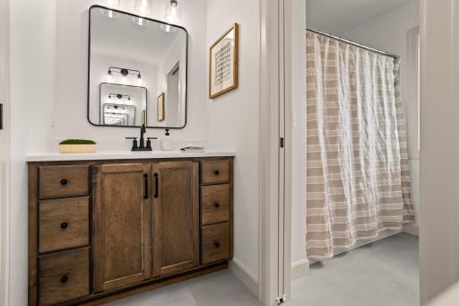 Double vanities, private stool + shower space, linen closet, natural light