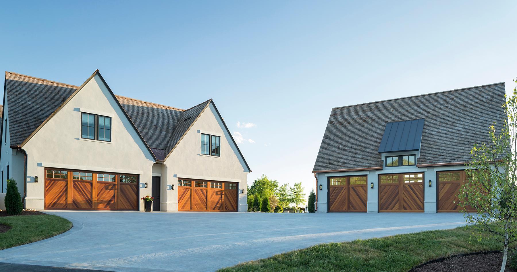 13 heated garage stalls with custom cedar garage doors and copper gutters