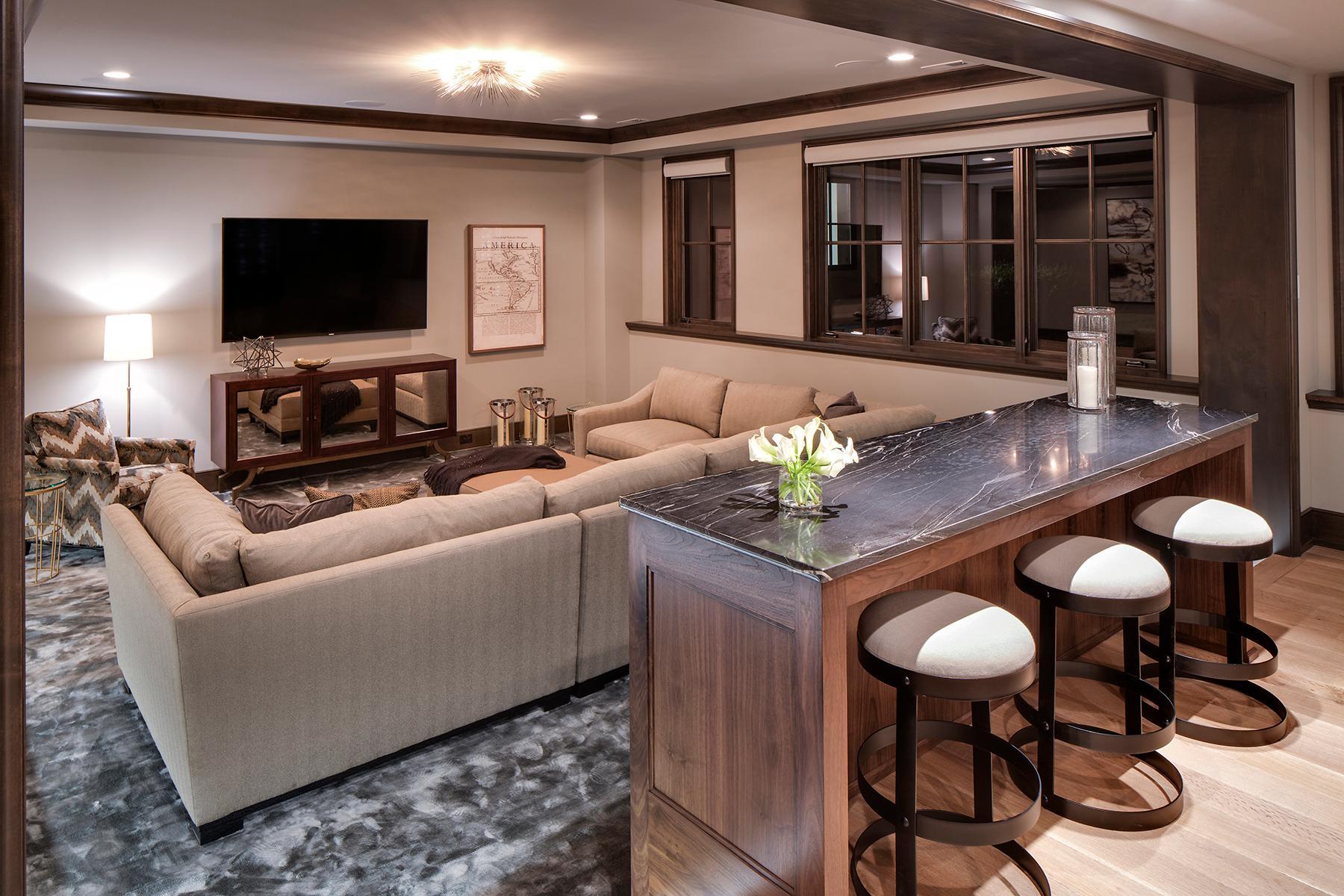 Sunken media area with ceiling height to accommodate a golf simulator