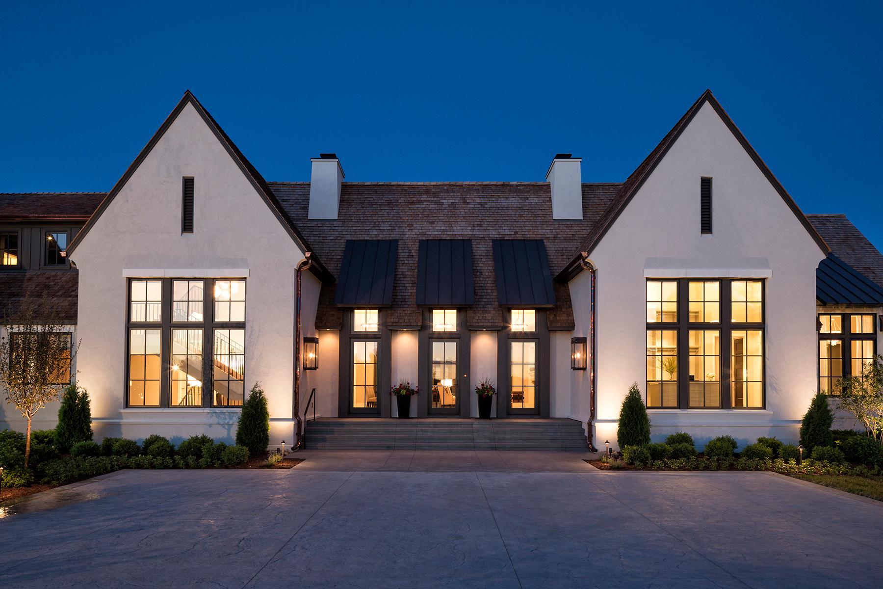 Expansive front entrance adorned with gas lanterns