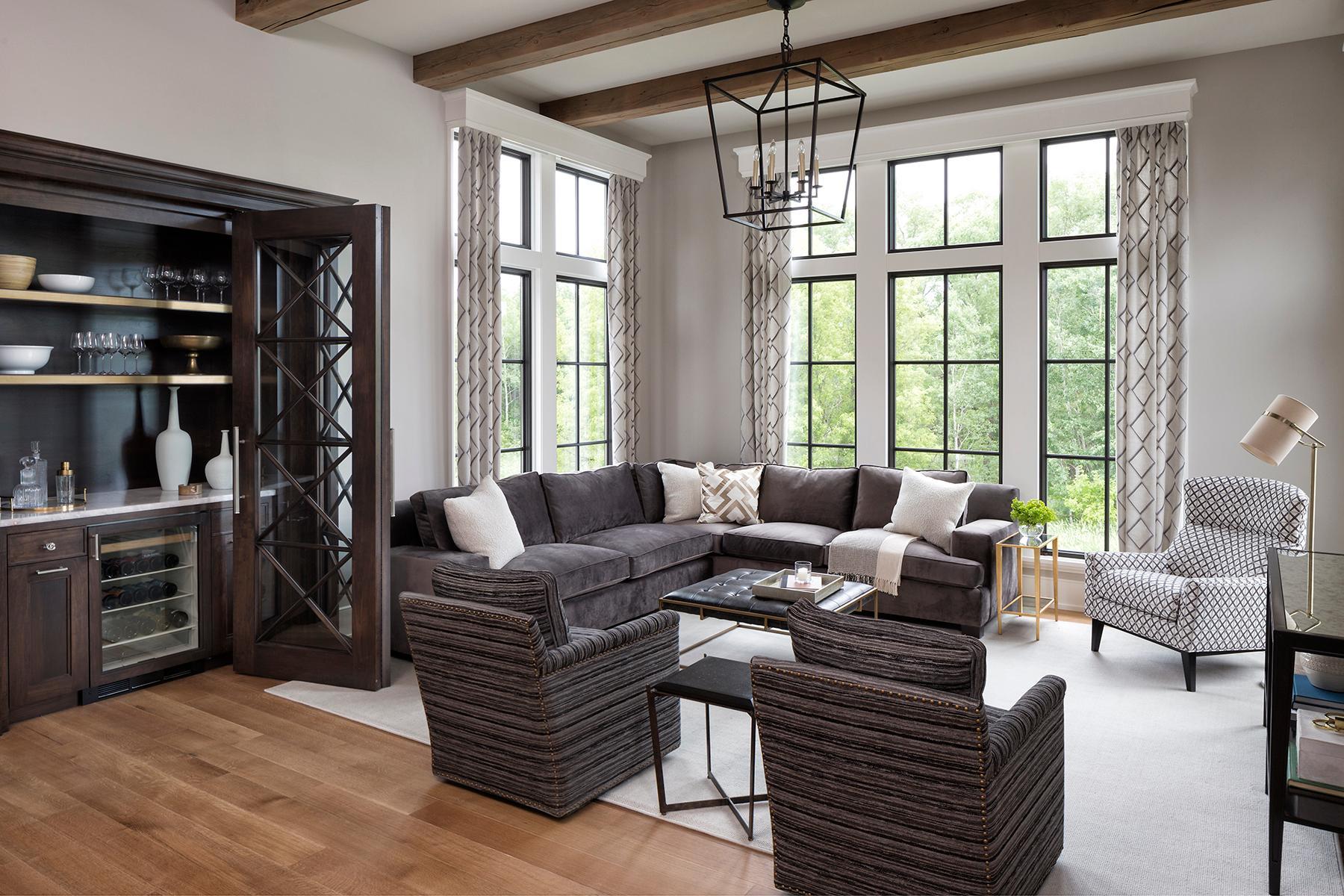 Alder custom bar with glass door inserts and cozy hearth room