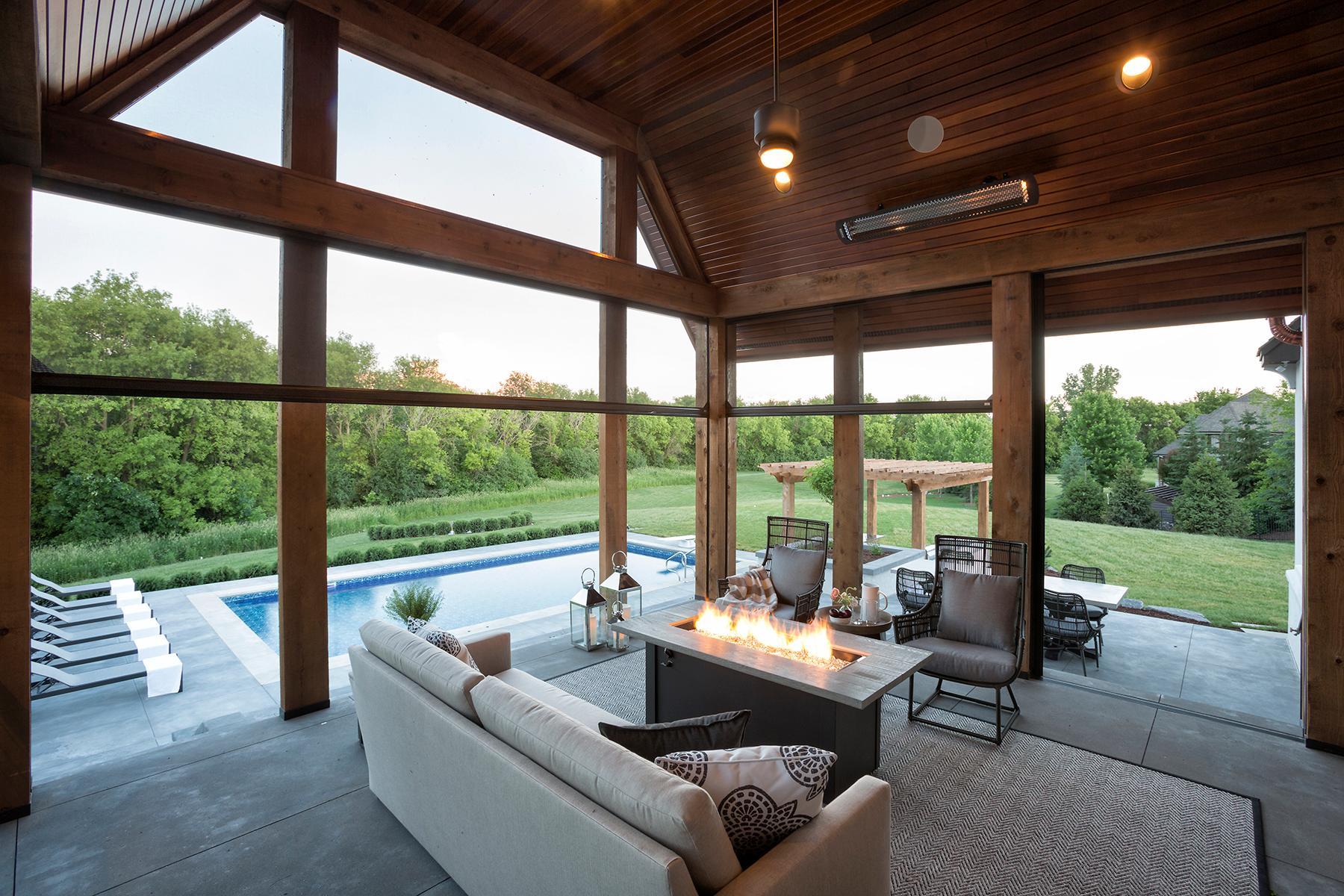 Heated screened porch with phantom screens and recessed media area