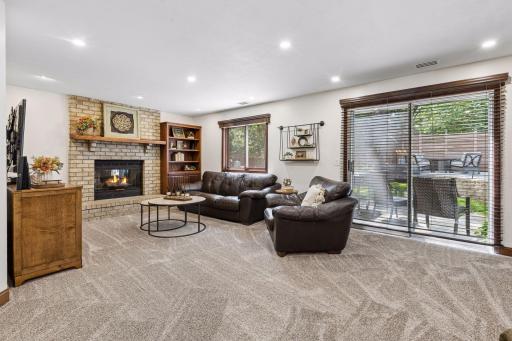 Large living room with woodburning fireplace.