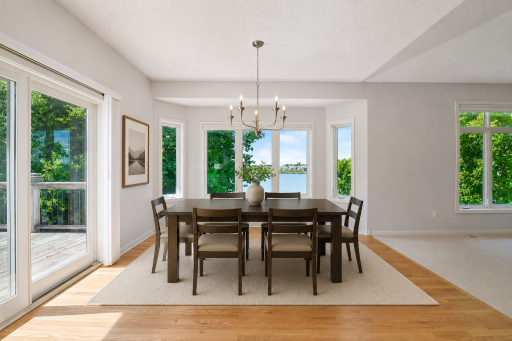 Freshly updated dining area with great natural light and easy flow to kitchen and great room. (Virtually staged.)