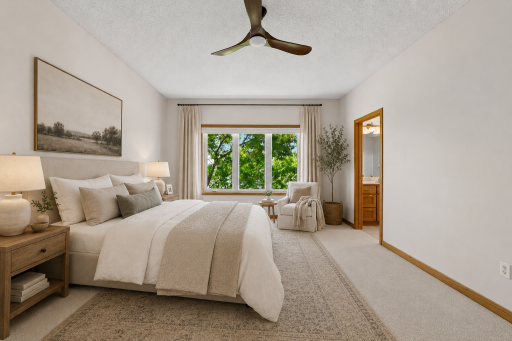 Spacious primary bedroom offering comfort, privacy, and peaceful views. (Virtually staged.)