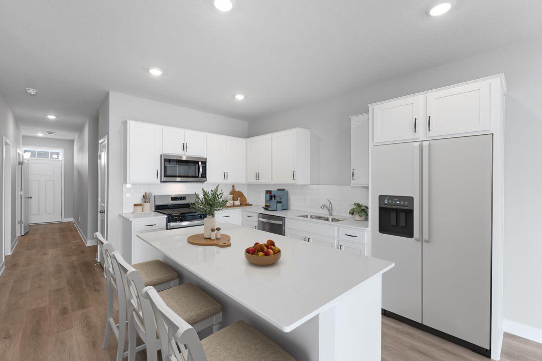 Highlighted with stainless steel appliances, quartz countertops and subway tile backsplash, this kitchen is showstopper. *Picture is of an inventory home; actual finishes may vary.