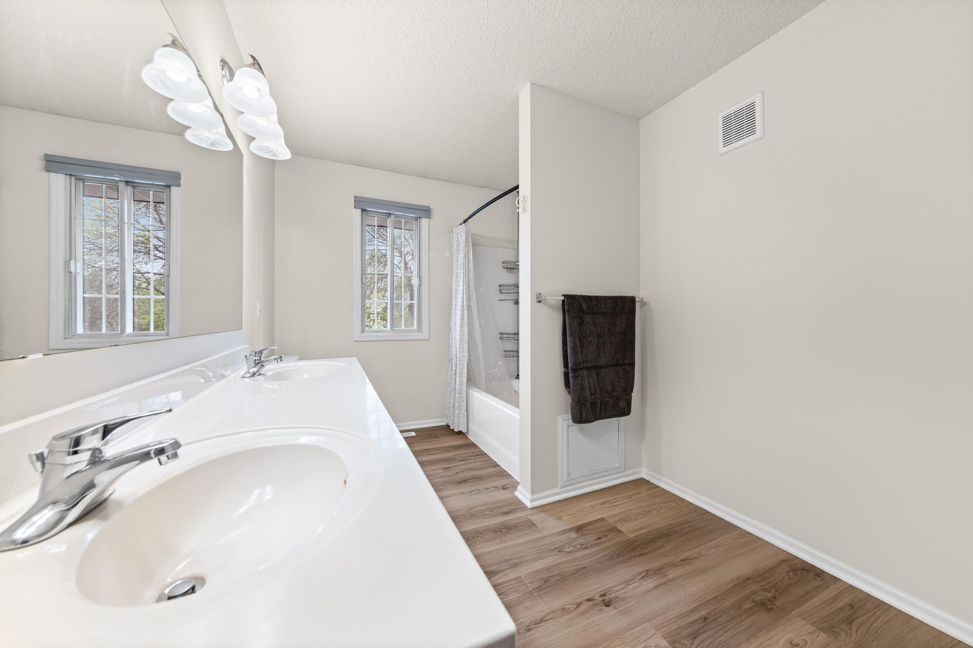 New LVP flooring in the upper level bathroom