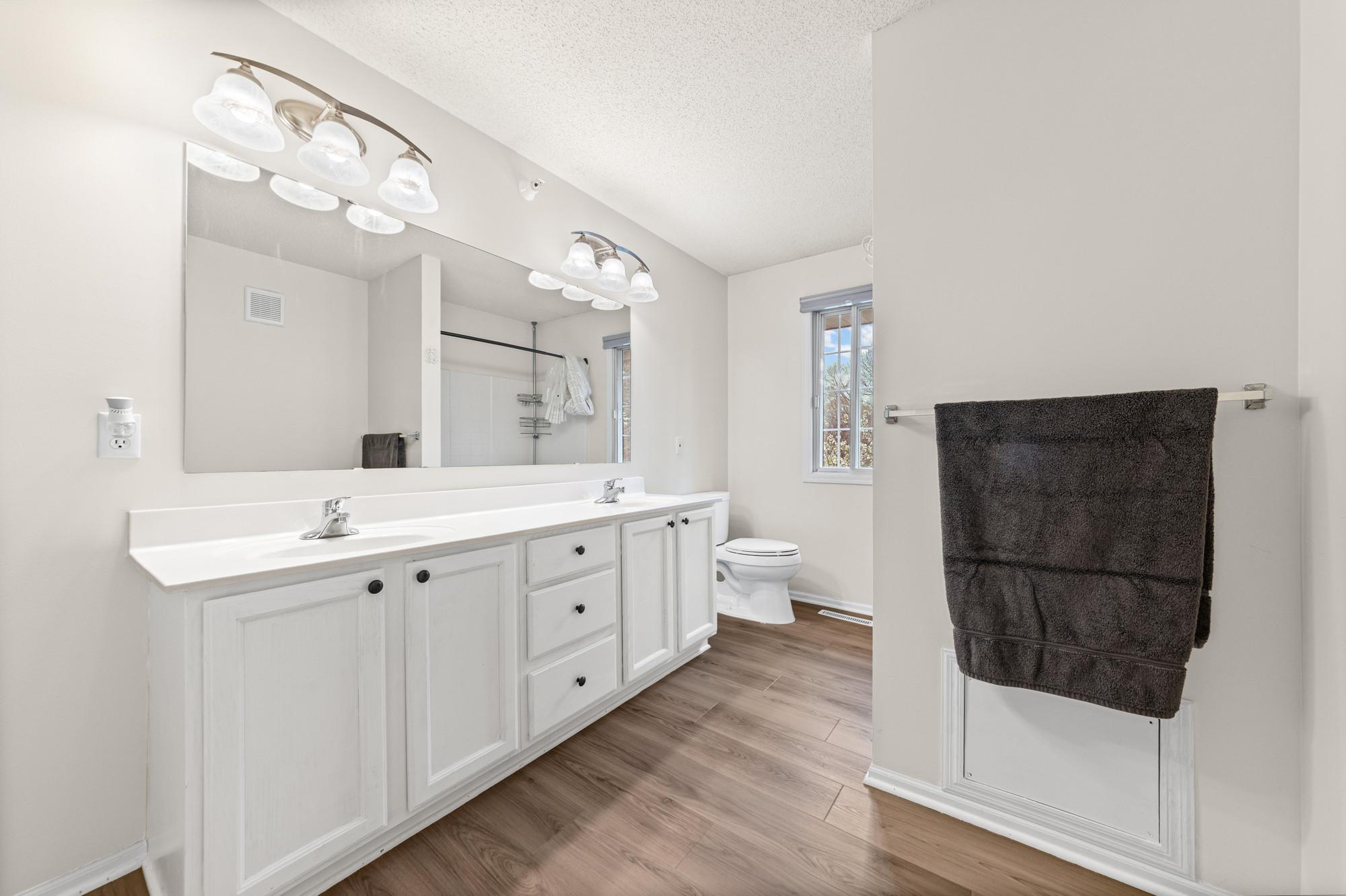 New LVP flooring in the upper level bathroom