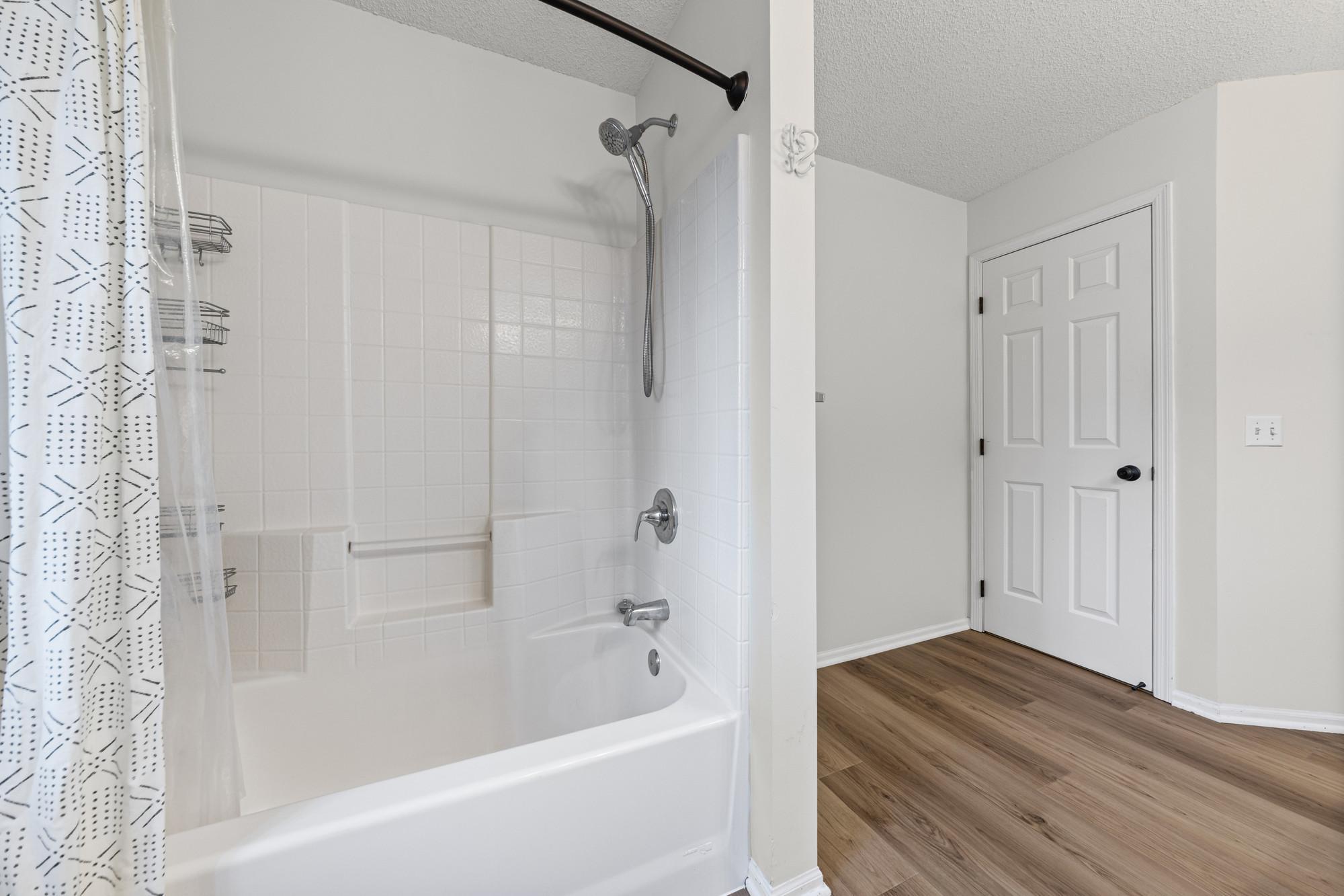 New LVP flooring in the upper level bathroom