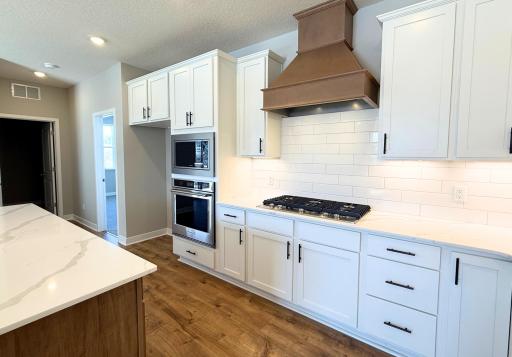 There are an exceptional amount of cabinets sure to fit all of your kitchen essentials! This is not the actual home, 1513 Clover Preserves will have the same colors and kitchen style.