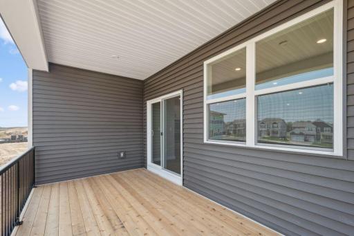 Another view of the covered deck. Color of home will vary.