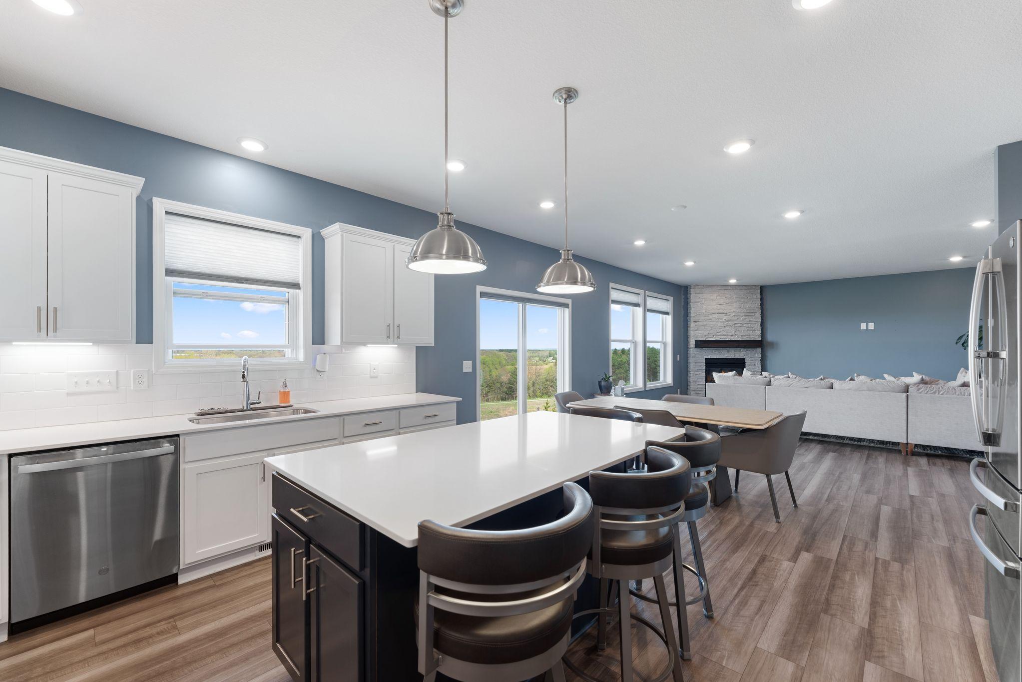 Kitchen with flow to Family Room