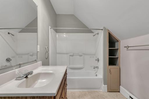 Clean full bathroom with storage space for your bathroom necessities.
