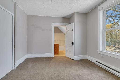 Upper level bedroom with private bathroom.