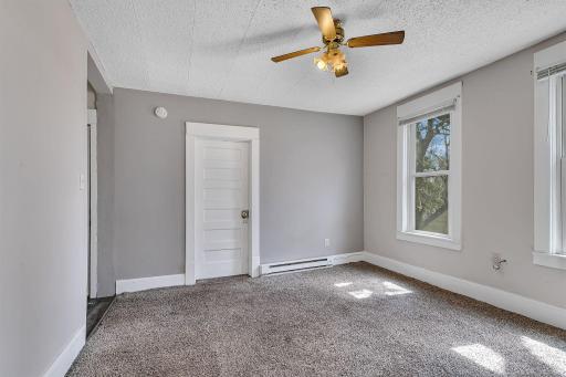 Ceiling fan helps maintain an airy feel.