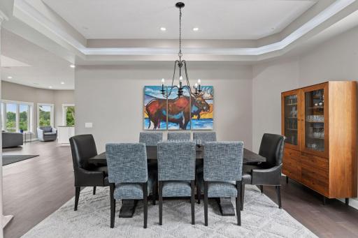 Formal dining area with tray ceiling detail.