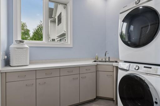 Main floor laundry room with new washer and dryer and half bathroom. Second laundry room in the lower level.