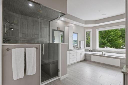 Stunning primary bath with steam shower and soaker tub.