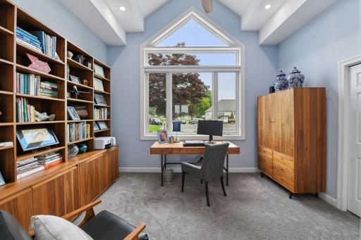 Main floor office/den. New Anderson windows and Hunter Douglas custom blinds installed in 2024.