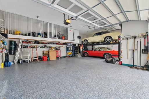 Upper level 3- car finished garage features a high door track on the third stall garage door - great for accommodating a car lift