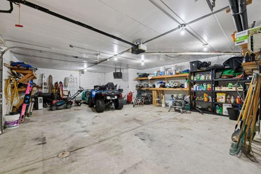 Heated 3-car lower-level garage - ideal for extra parking or storing all your lake and patio accessories!