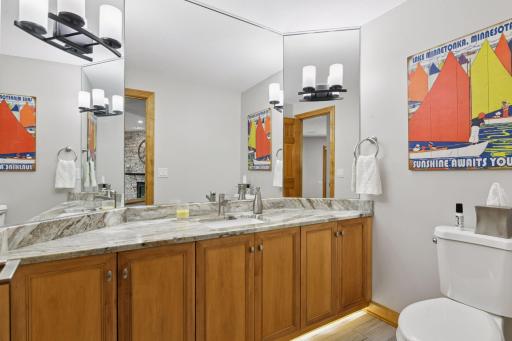 Lower - level 1/2 bathroom with under cabinet lighting.