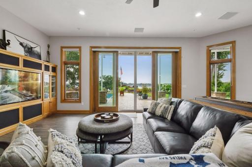 Tall French door invite you to the patio and swimming pool area