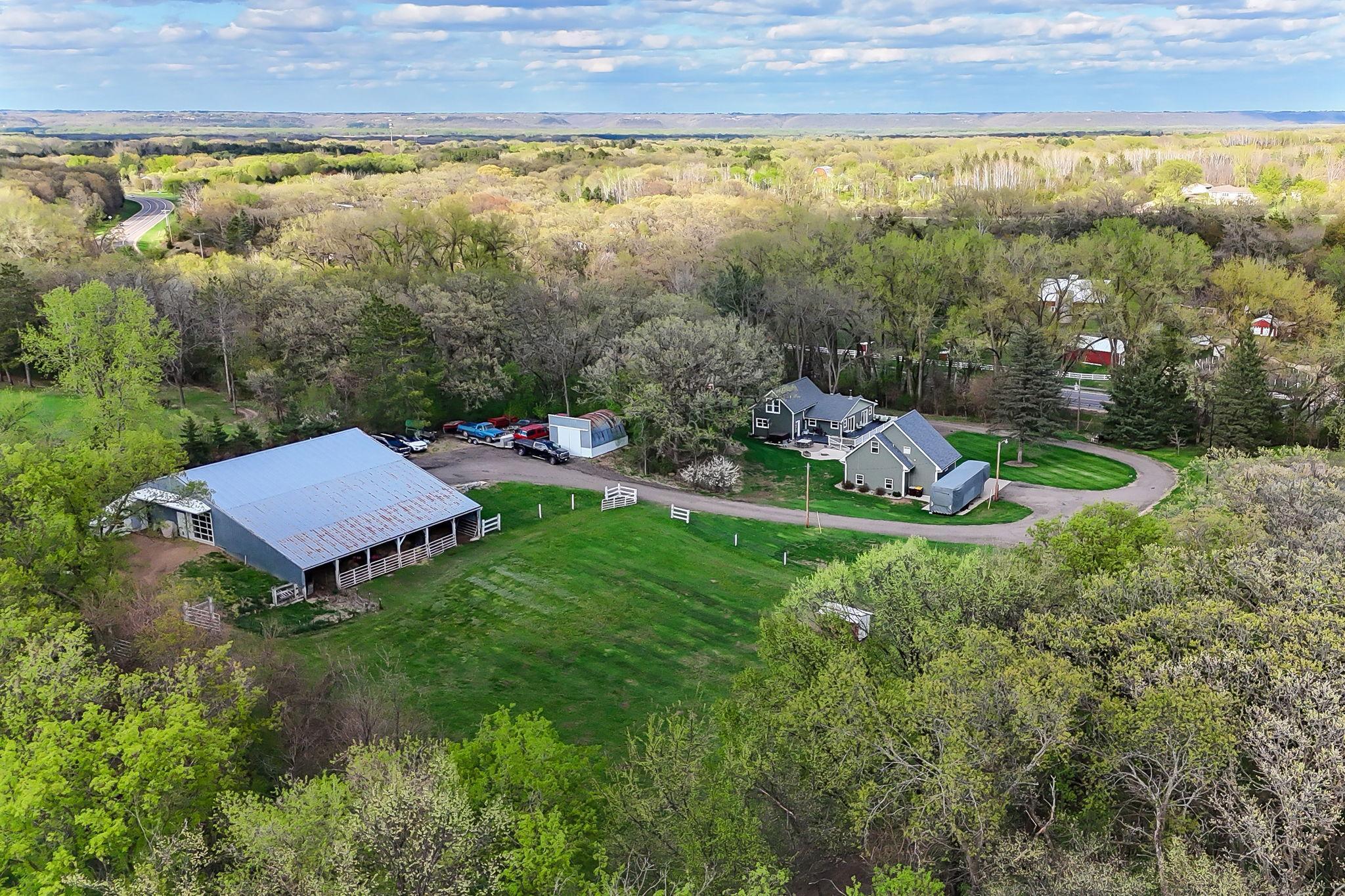 6.5 acres of beautifully set up land with outbuildings, pasture space, and a private, tucked-away setting.