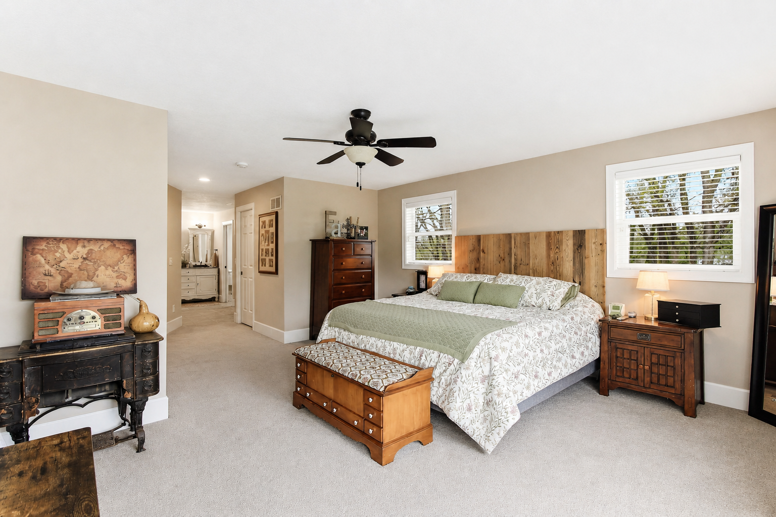 Main level Owner’s Suite with generous space, natural light, and private bath.