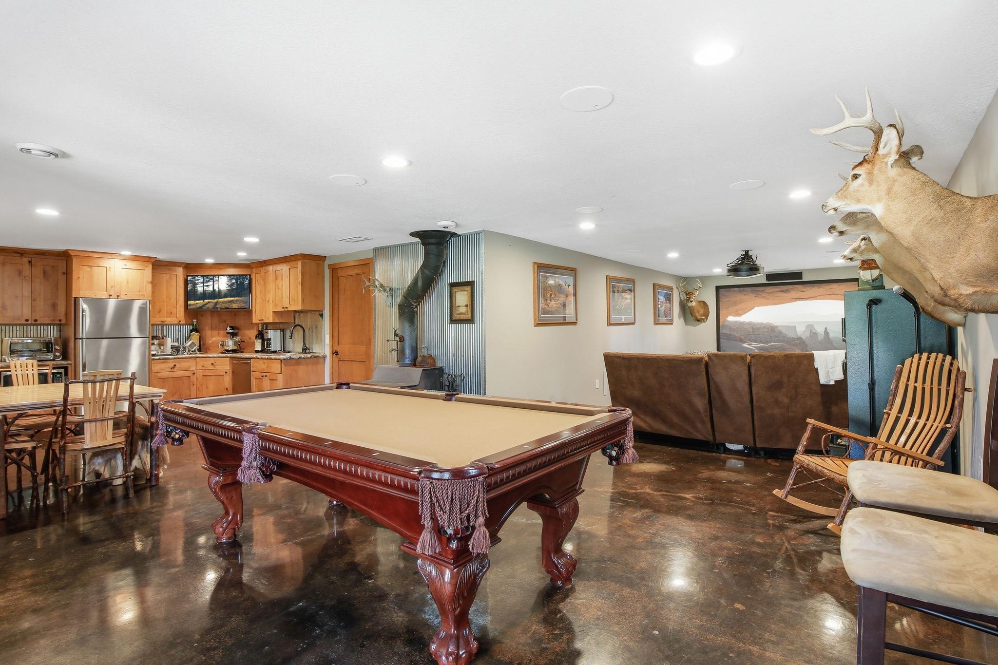 Walkout lower level set up for entertaining with kitchenette, open space, and room to customize.