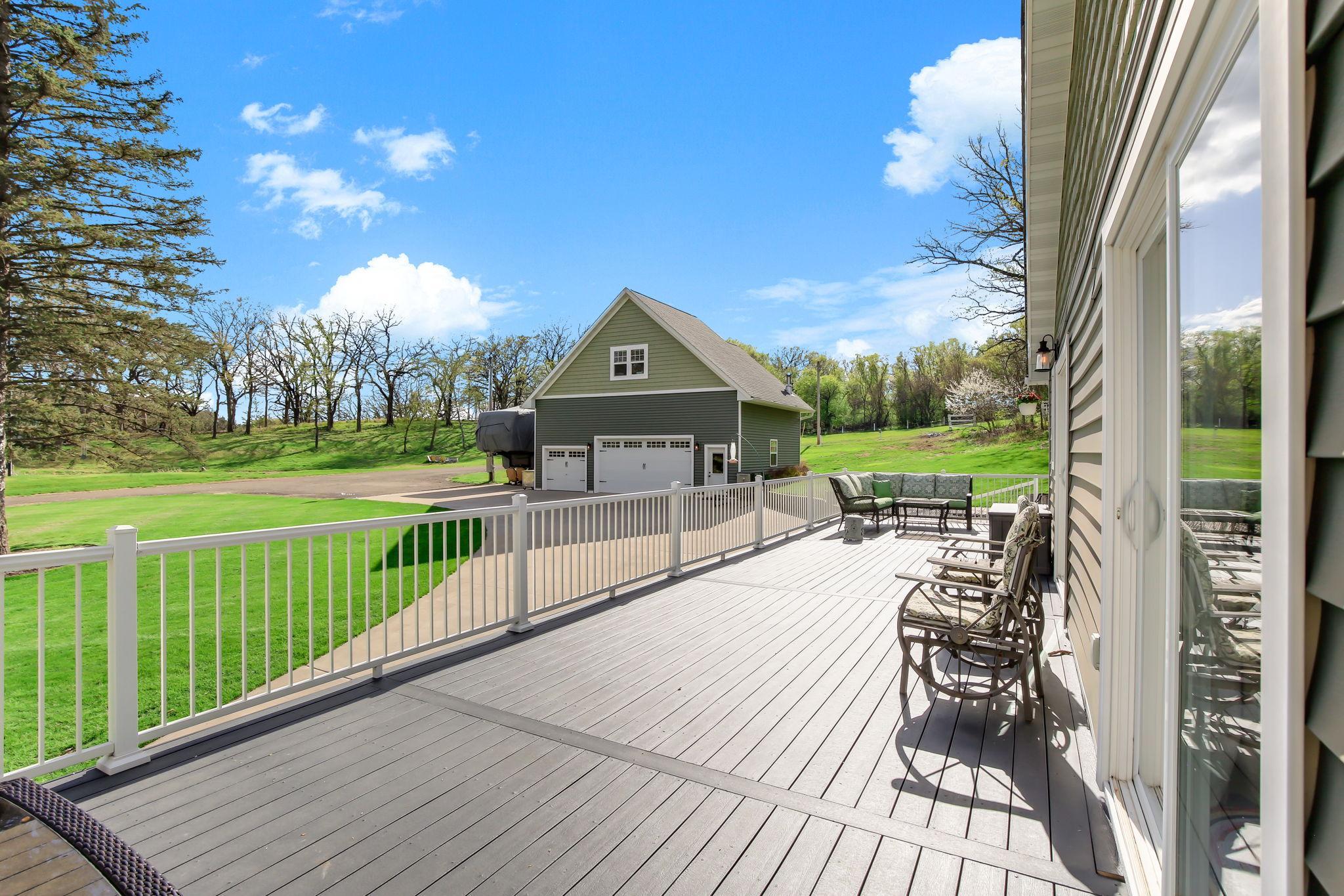 Maintenance-free wraparound deck with wide-open views of the property - plenty of space to relax or entertain.