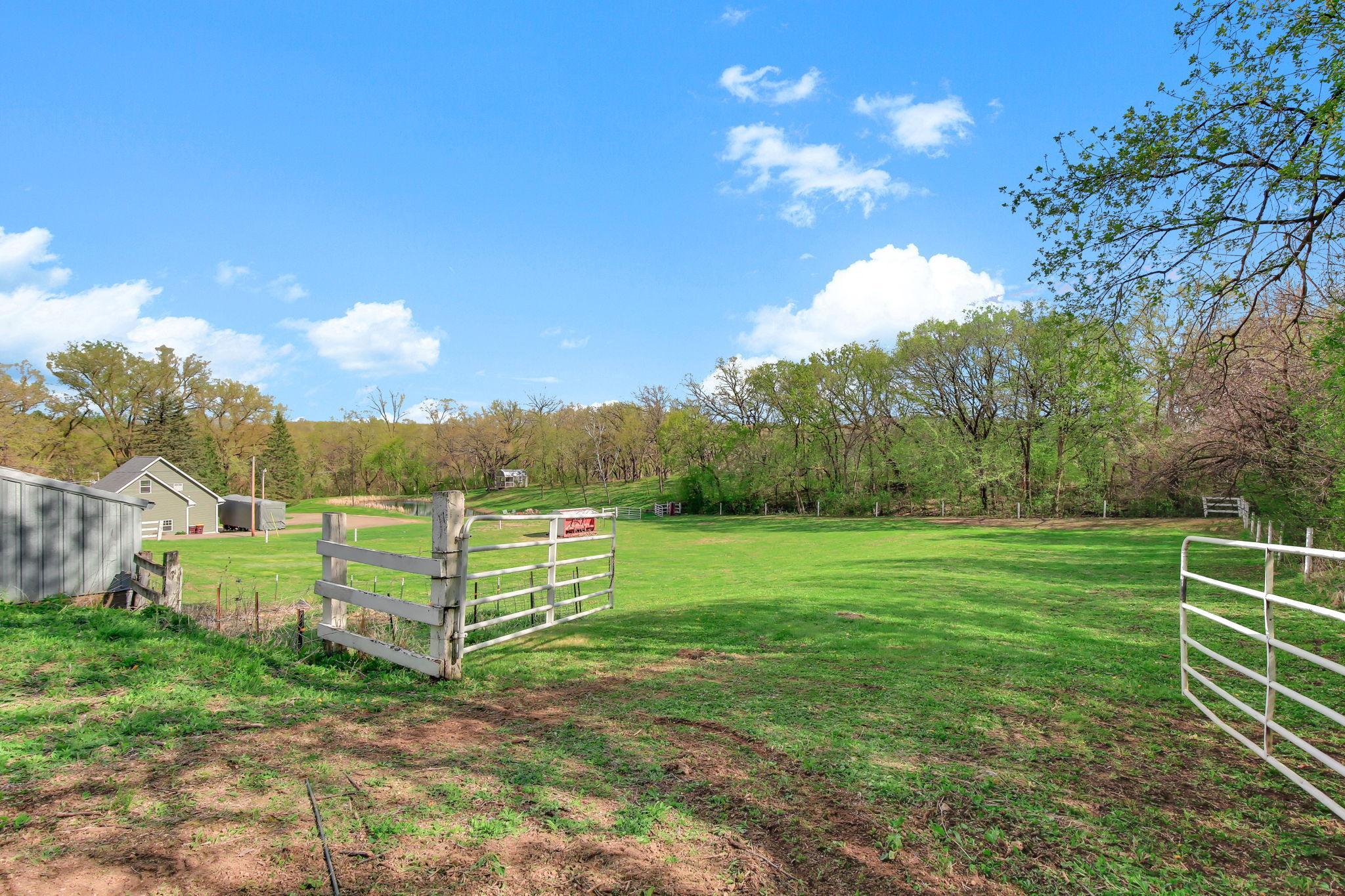 Fenced pasture with open space and easy access - ideal setup for animals to roam.