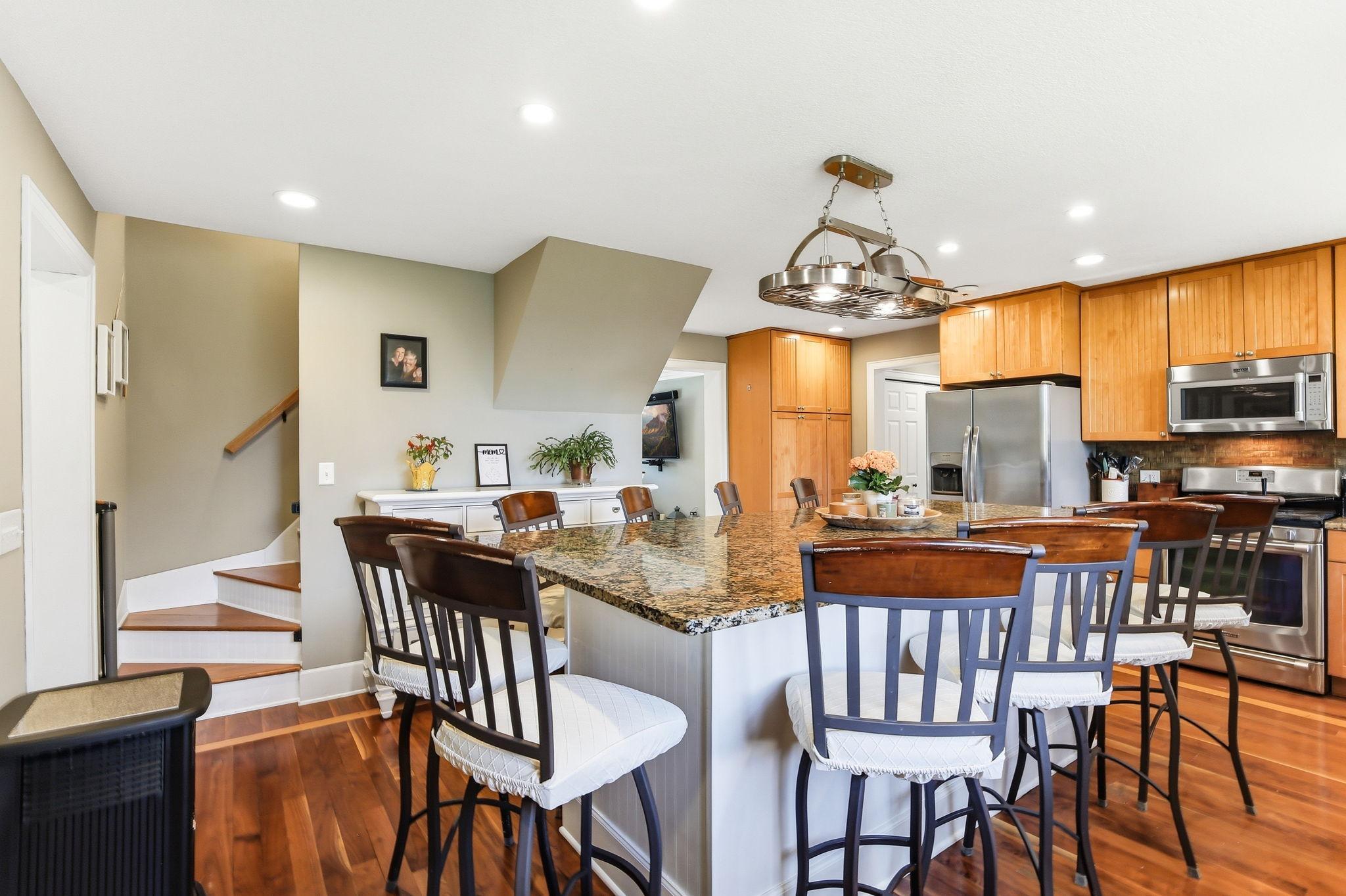 Large center island anchors the space - ideal for gatherings, prep space, and everyday living.