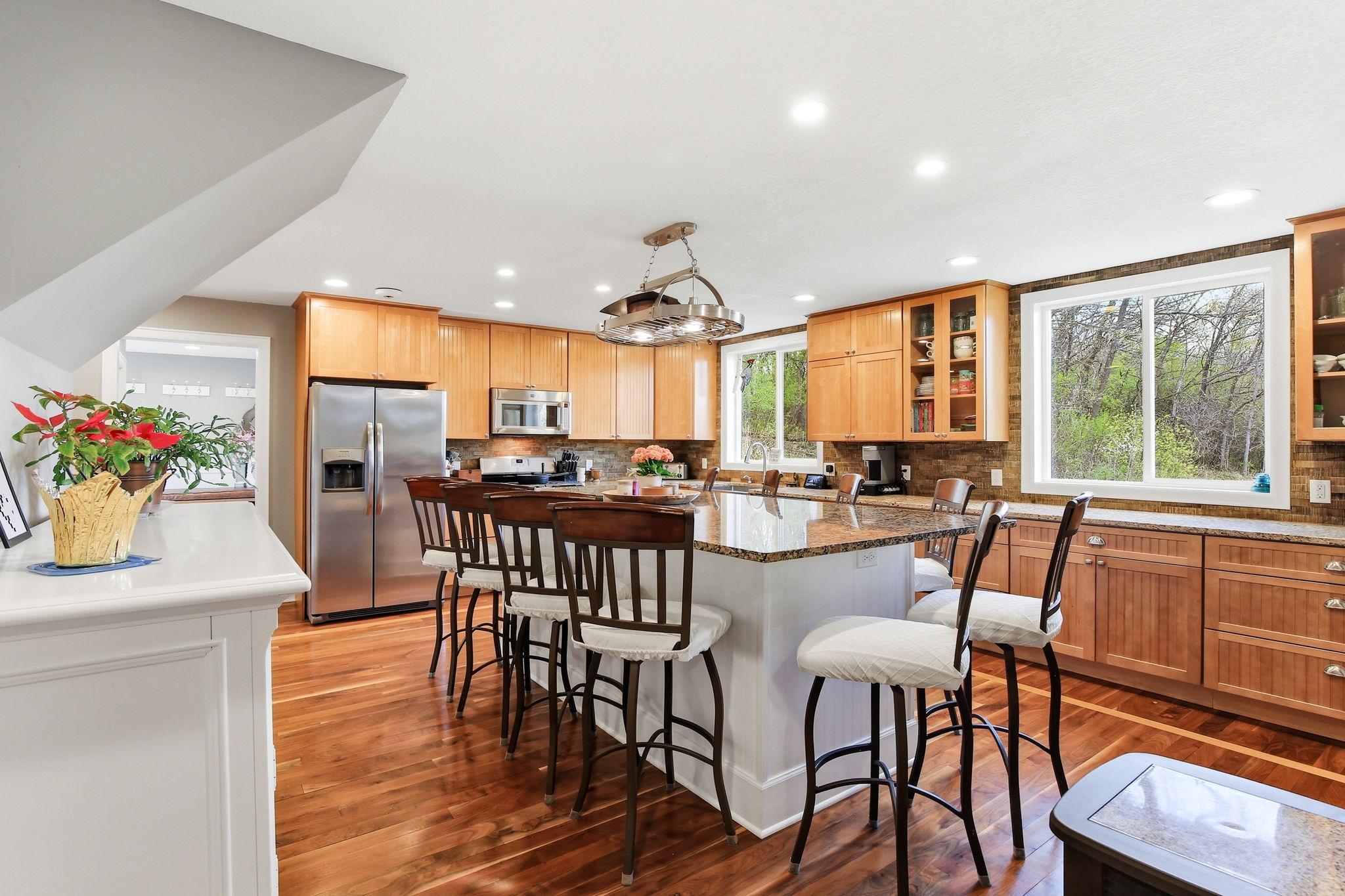 Spacious Kitchen layout with oversized island, plenty of seating, and open flow to main living areas.
