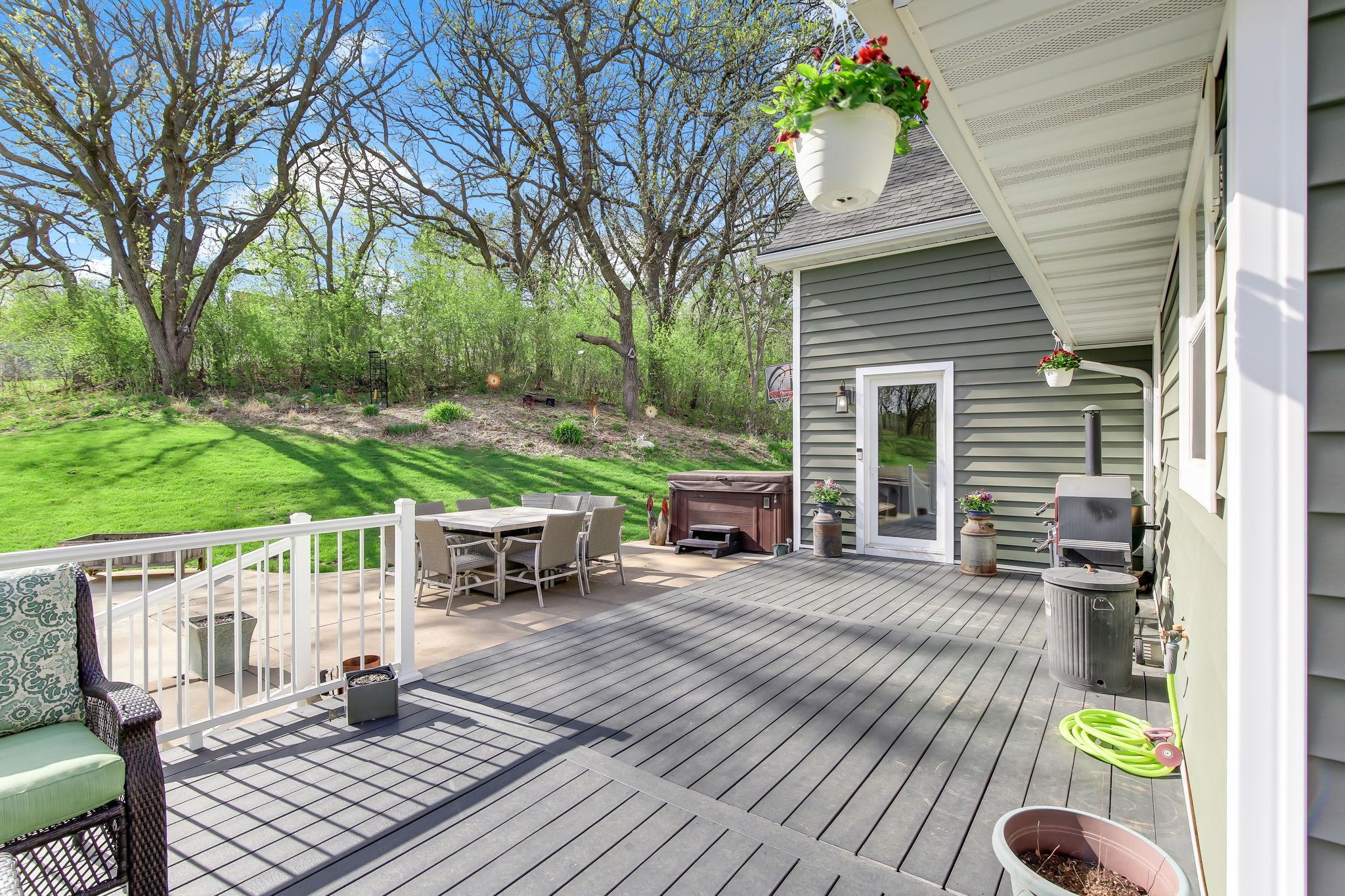 Outdoor living space designed for relaxing and entertaining with views of the property.