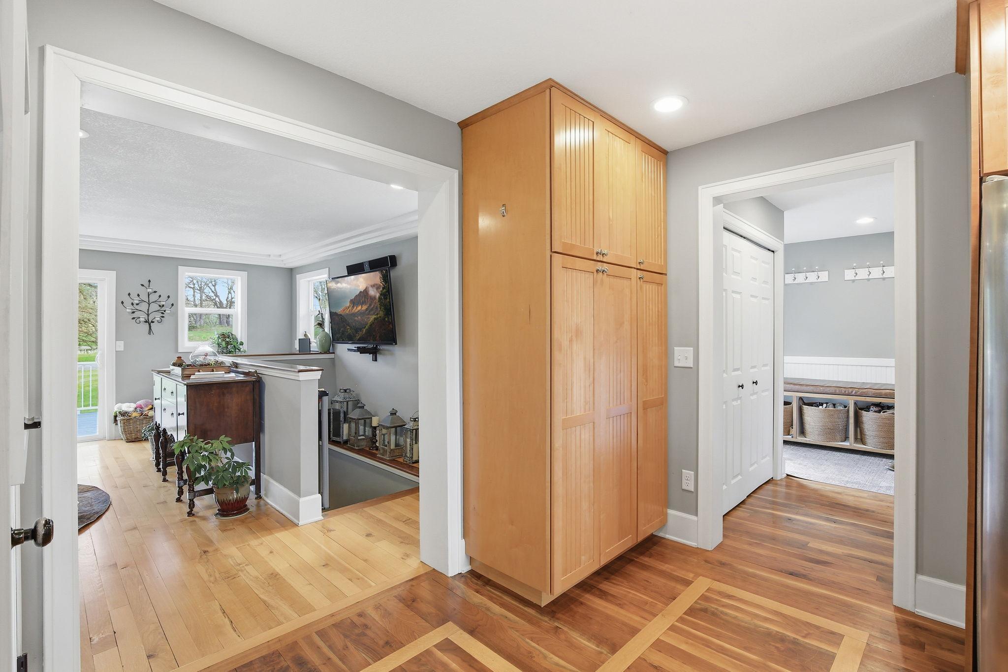 Beautiful hardwood floors with inlay detail carry through the Kitchen and adjoining spaces.