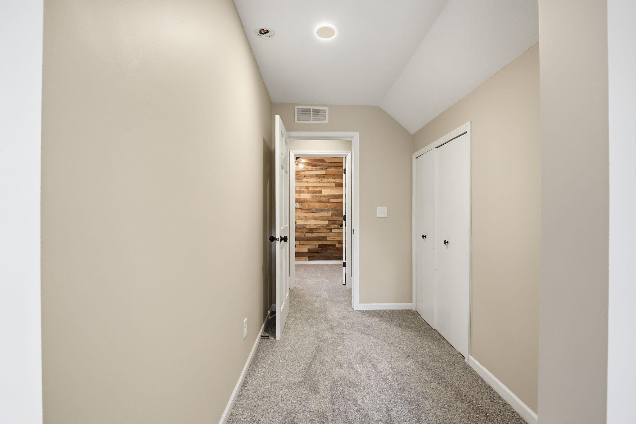 Hall into the vaulted bedroom - door to walk-in closet.
