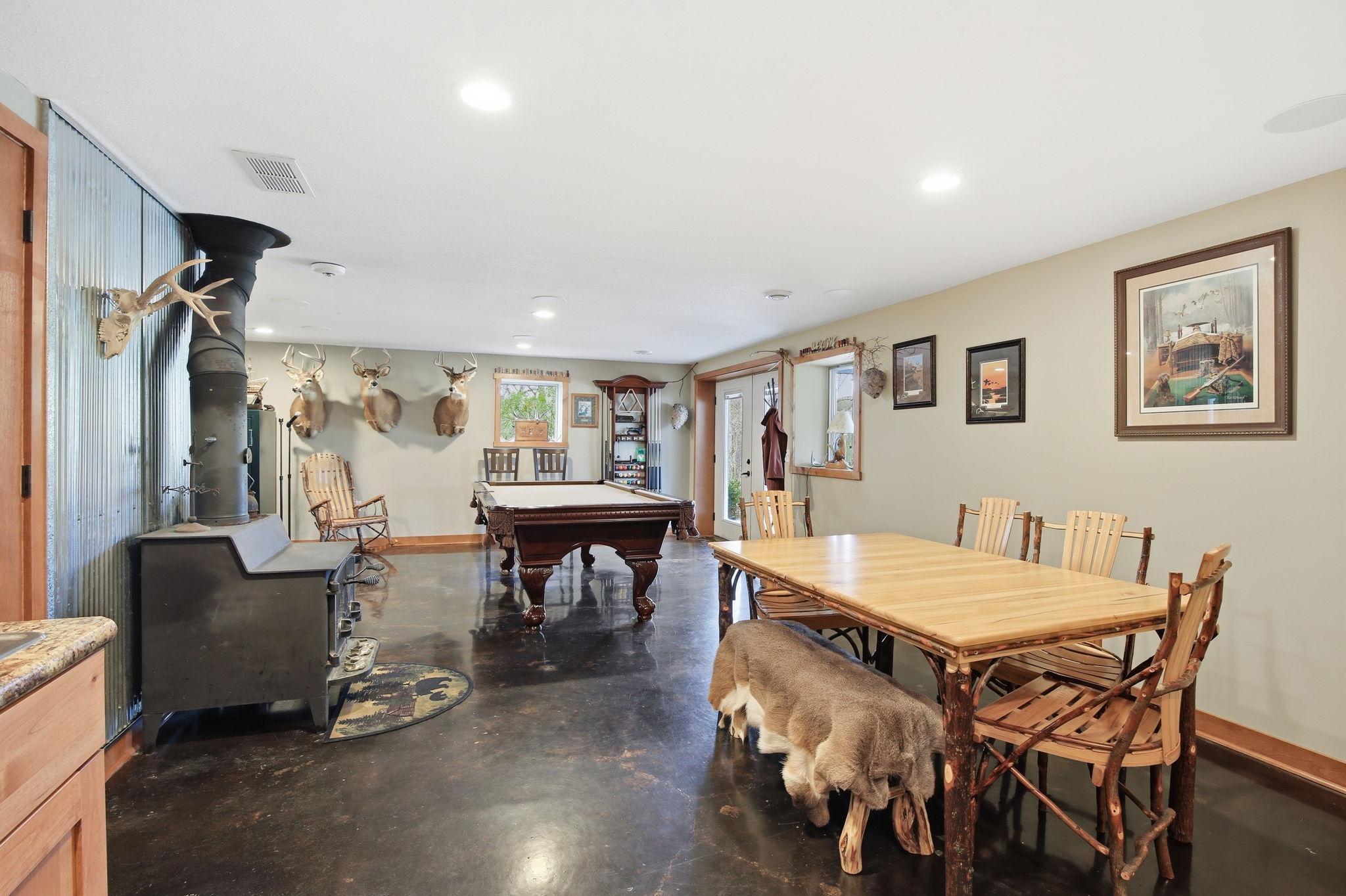 Spacious Lower Level with wood stove, game area, and room for entertaining. Walkout to exterior with double doors.