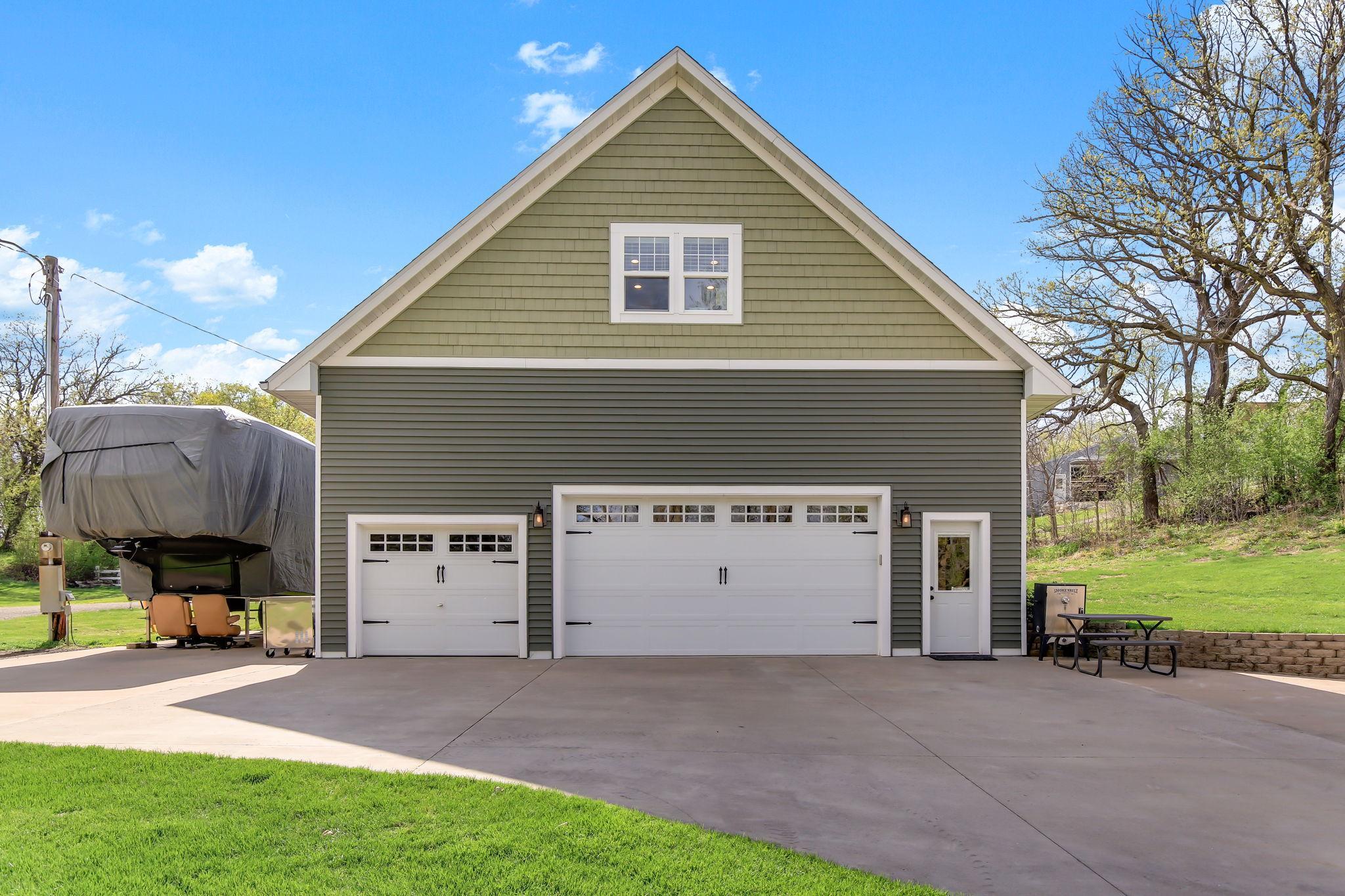 Huge detached Garage with a finished room above it - great for a guest room, hobby room or office.