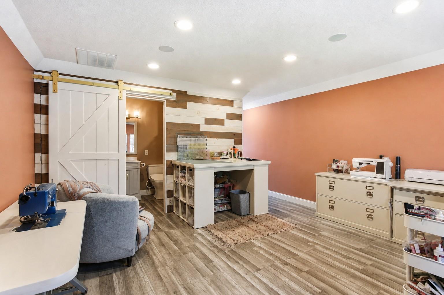 Spacious Bonus Room above the Garage is finished with heat. AC and a 3/4 bath. Great space for hobbies, office or a guest room.