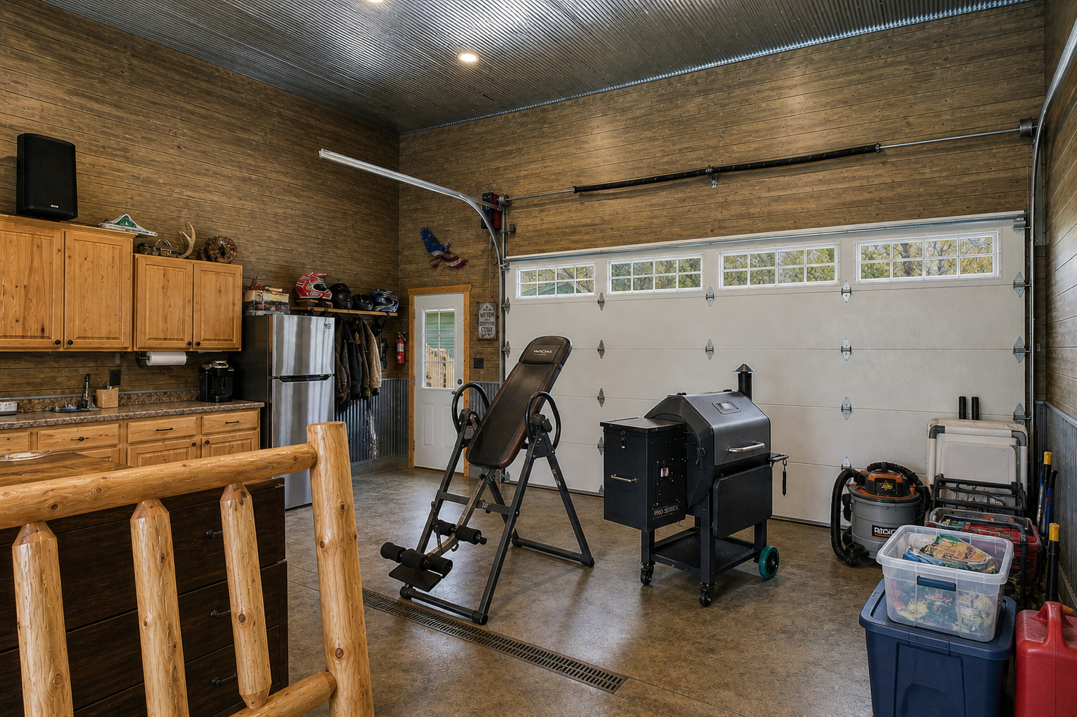 Finished Garage space with cabinetry, work area, and room for hobbies or entertaining.