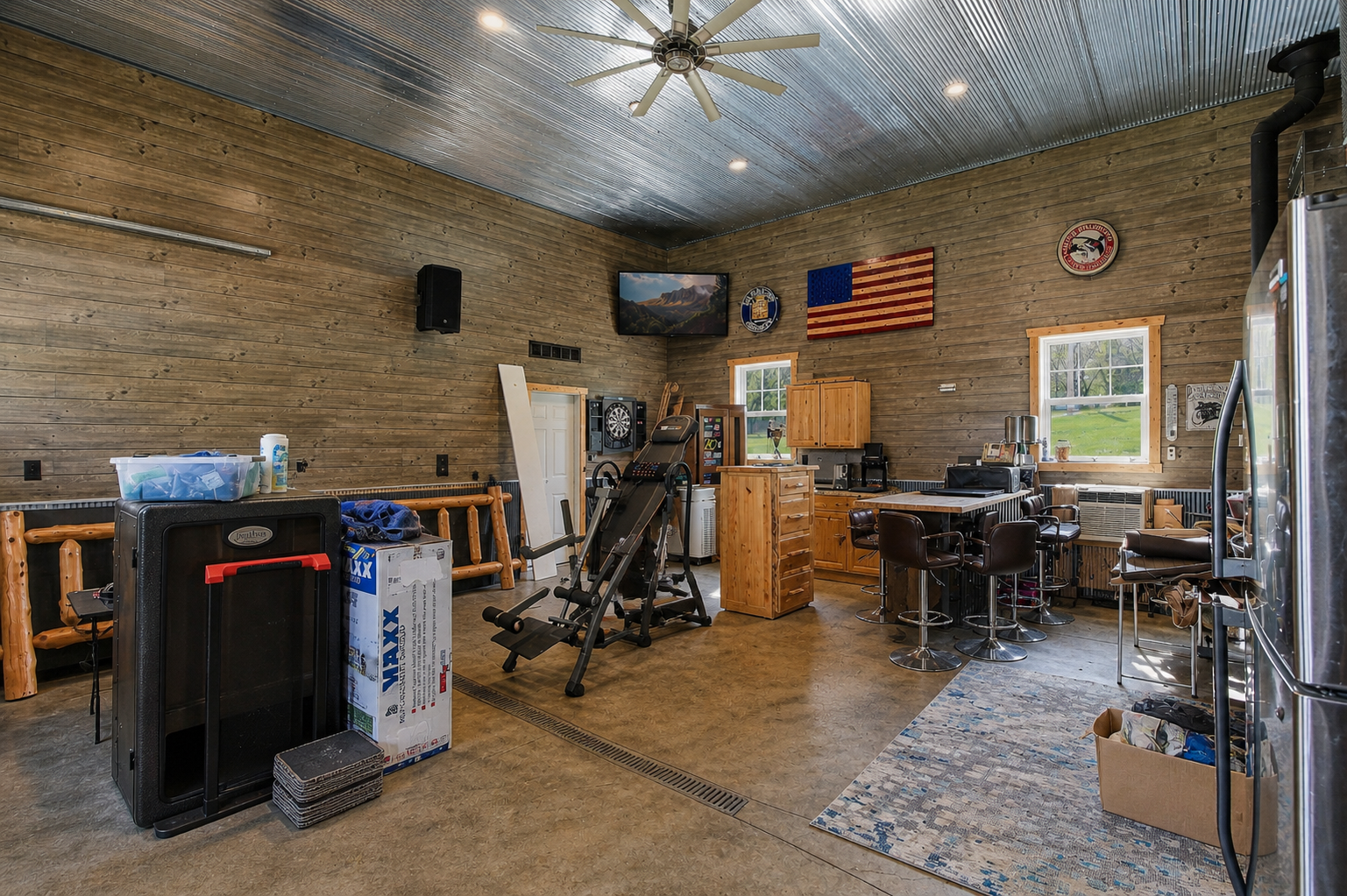 Another view of the finished garage. The 3rd stall is in a separate area as well as the stairwell to the finished upstairs room.